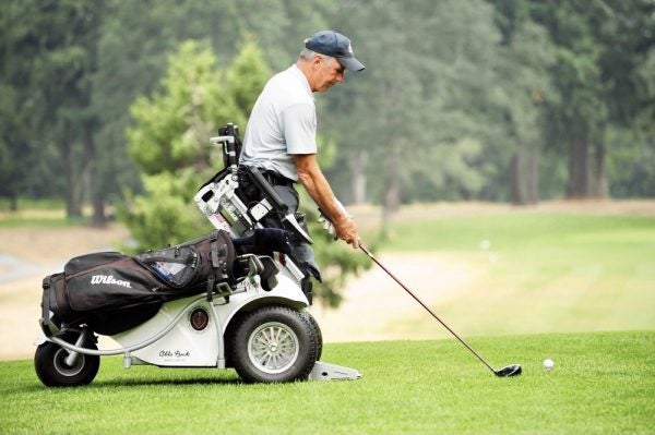 Picture of a man using a VertaCat to golf.